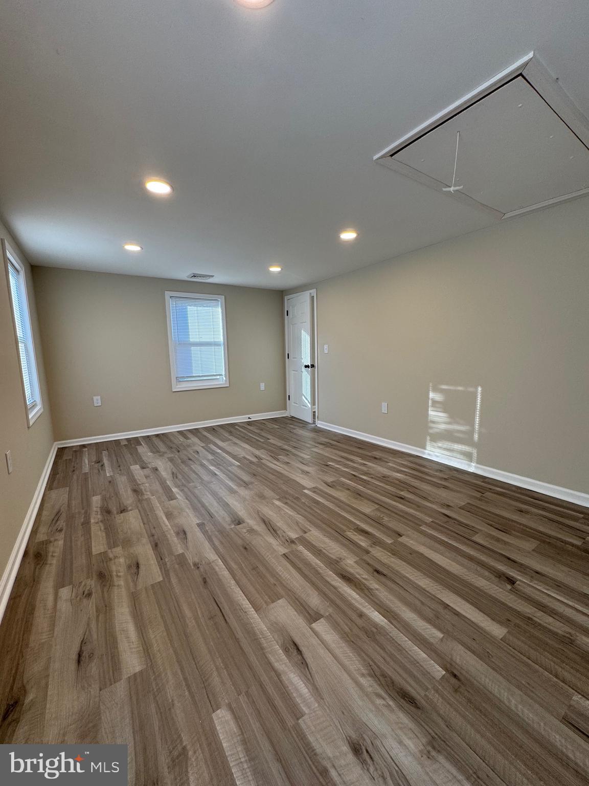 2389 White Oak Road Dover, DE 19901 - Photo 24 of 25 an empty room with wooden floor and windows
