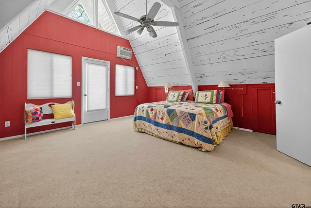 a bedroom with a bed and a table