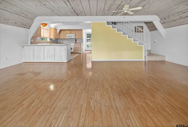 a view of a kitchen with wooden floor