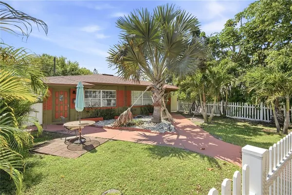 a view of a backyard with a patio