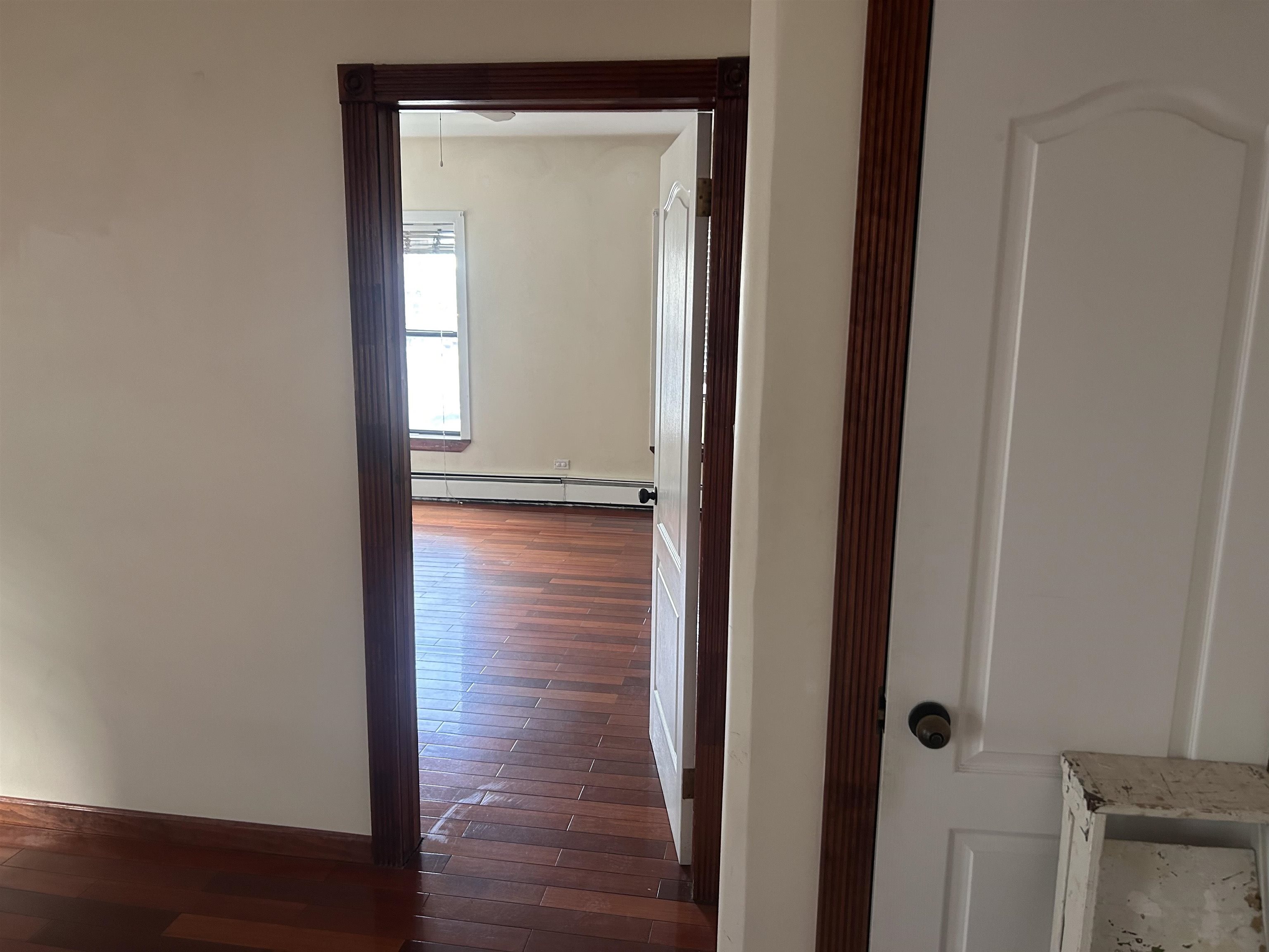 236 Grove Street Jersey City, NJ 07302 - Photo 5 of 7 a view of empty room with wooden floor