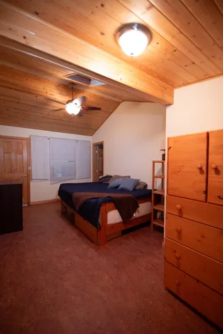 a backyard of a house with yard and outdoor seating