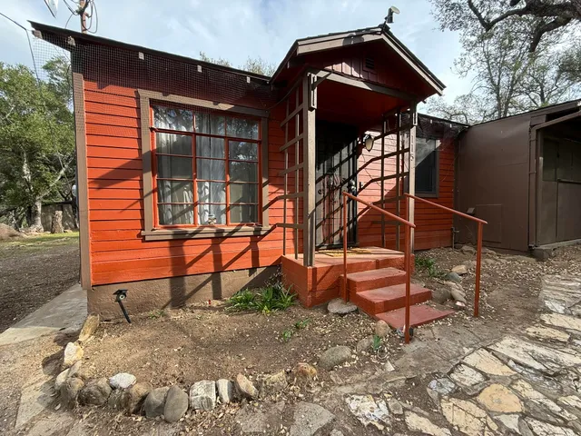 a view of a house with a bench