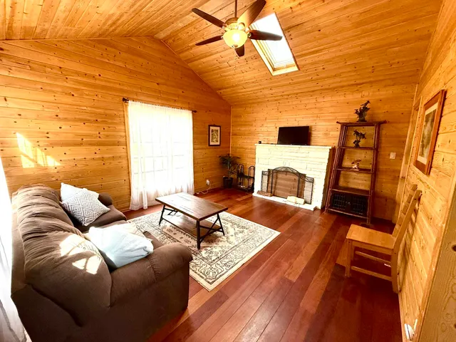 a living room with furniture and a rug