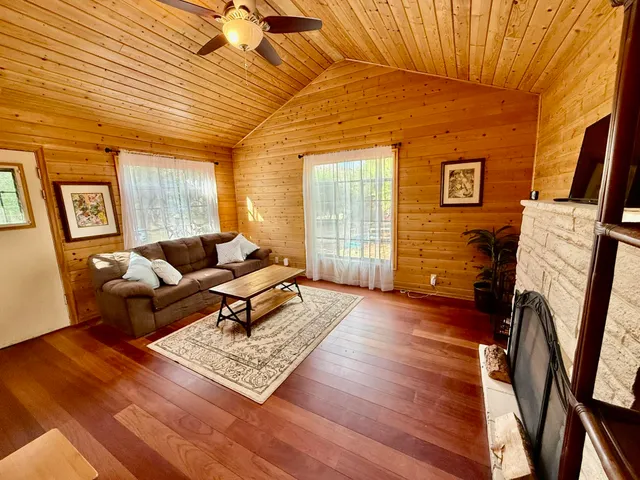 a spacious bathroom with a granite countertop sink and a mirror