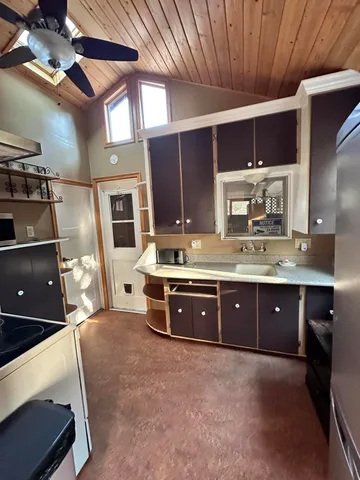 a kitchen with cabinets and appliances