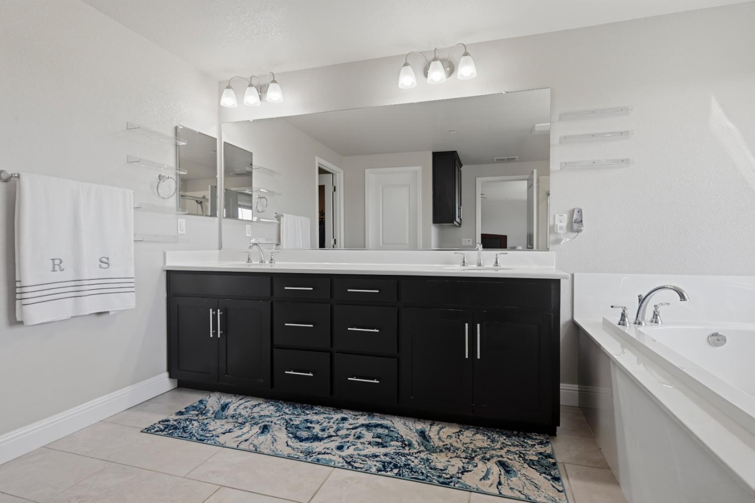2012 Van Ruiten Drive Lodi, CA 95242 - Photo 32 of 49 a bathroom with a sink double vanity and a mirror