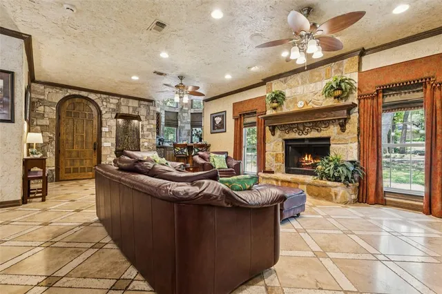 a living room with fireplace furniture and a fireplace