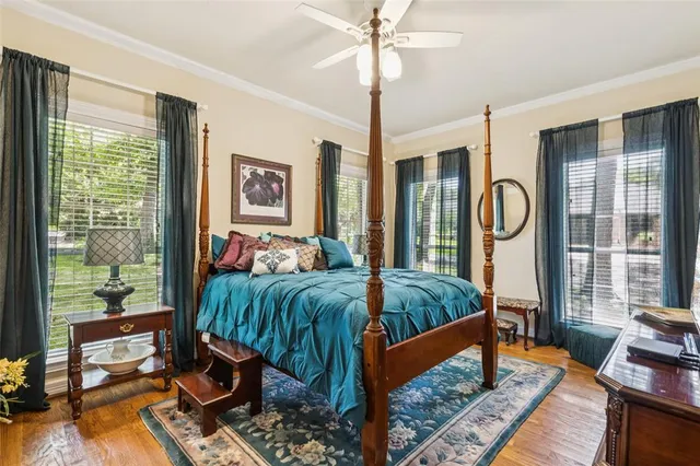 a bedroom with a bed and window