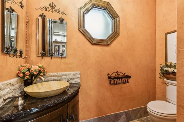 a view of a porch with furniture and garden