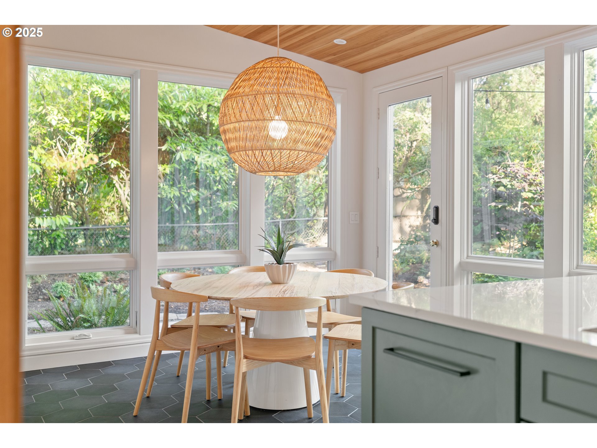 6328 Southwest Brugger Street Portland, OR 97219 - Photo 13 of 48 a dining room with a window and a table