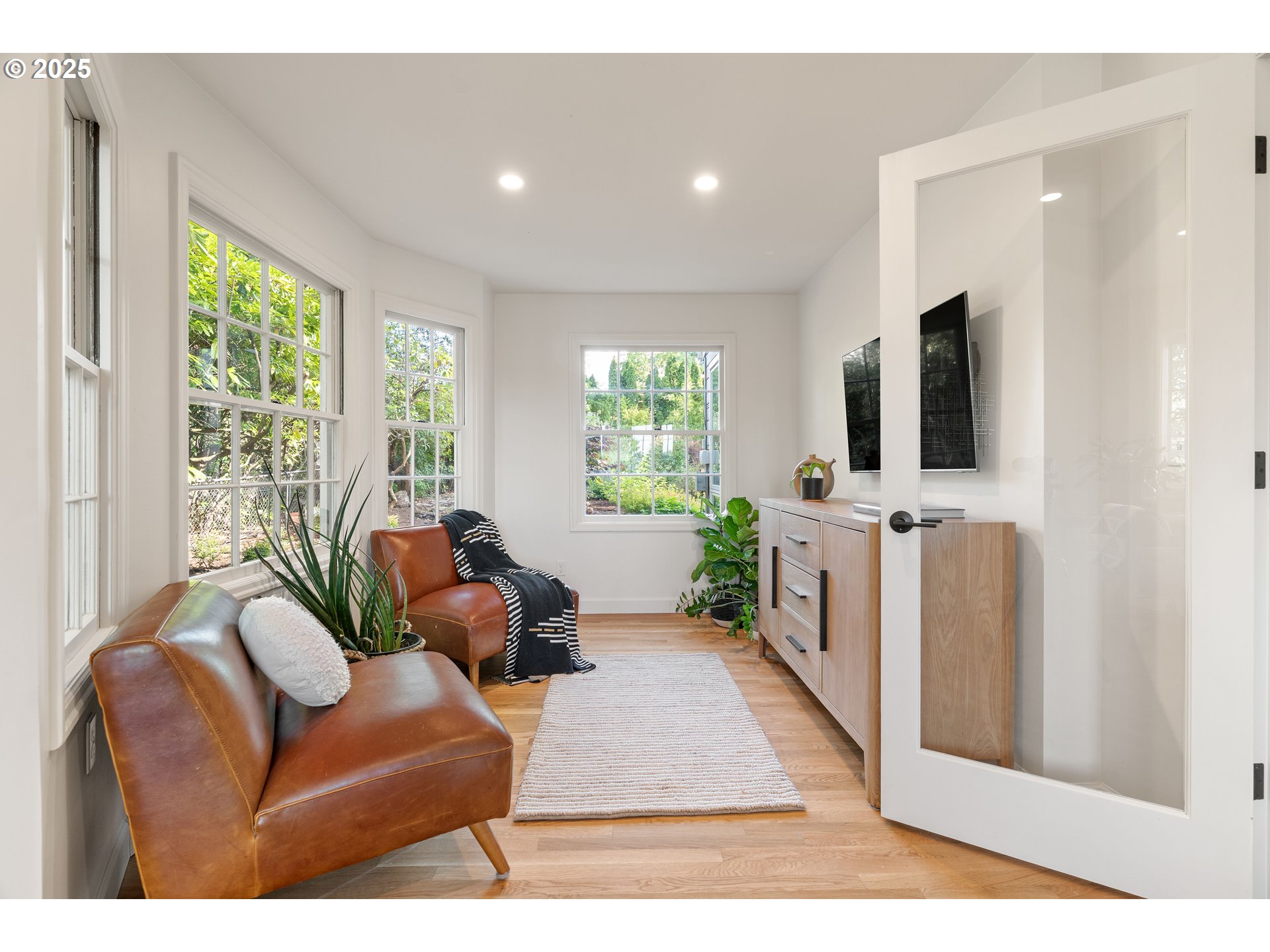 6328 Southwest Brugger Street Portland, OR 97219 - Photo 17 of 48 a living room with furniture and a flat screen tv