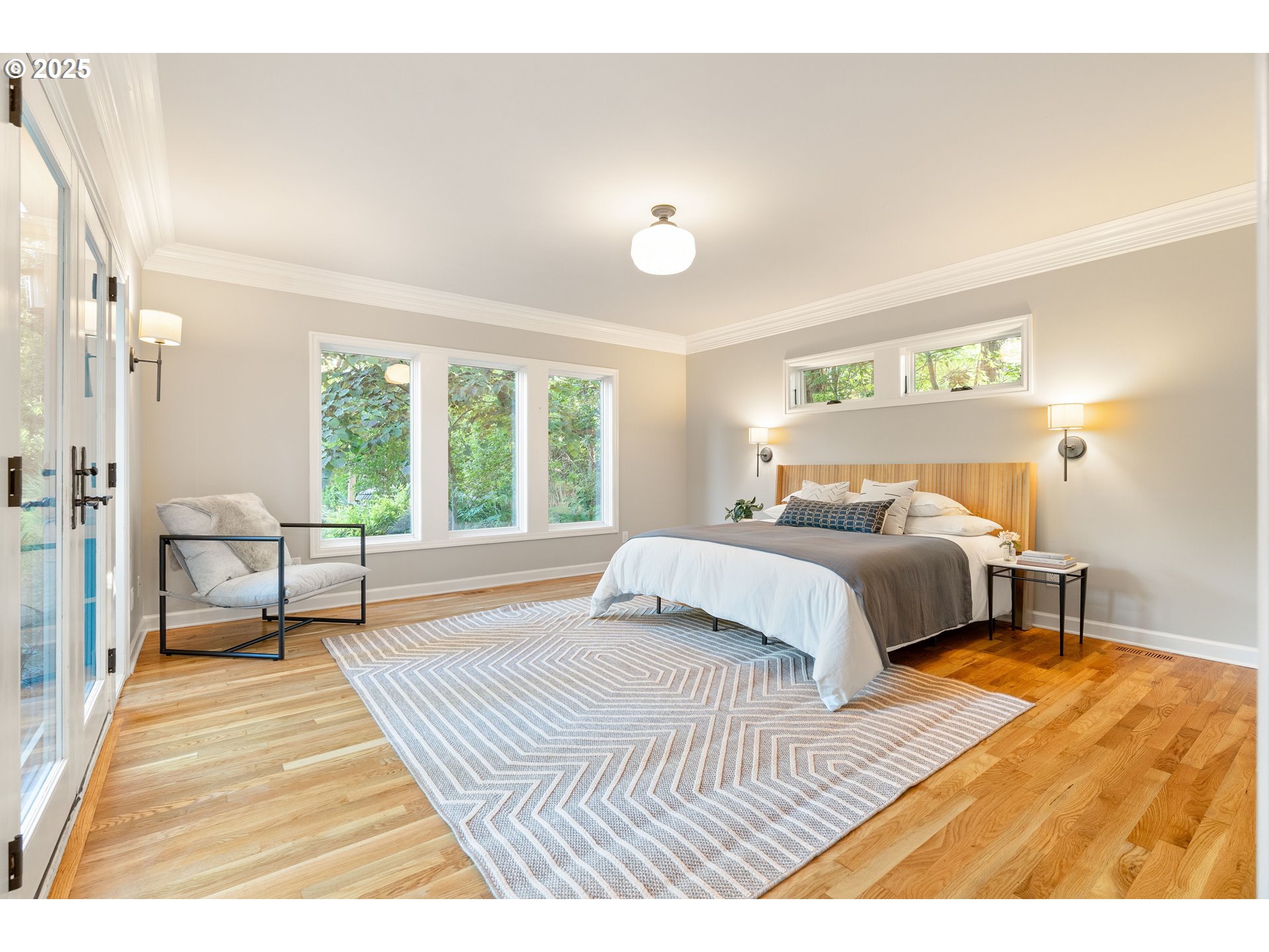 6328 Southwest Brugger Street Portland, OR 97219 - Photo 19 of 48 a bedroom with a large bed and a large window