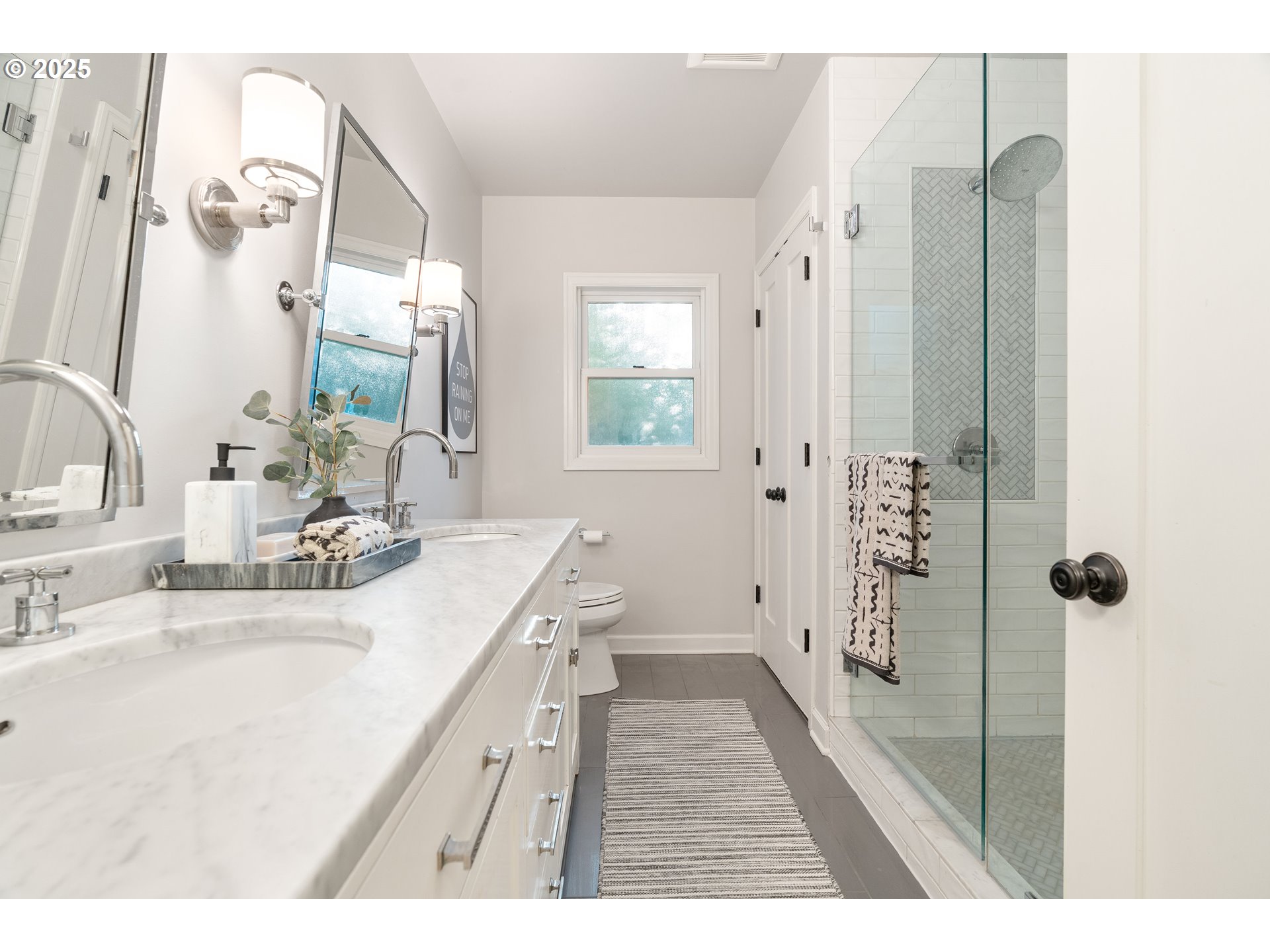 6328 Southwest Brugger Street Portland, OR 97219 - Photo 22 of 48 a bathroom with a sink a toilet a mirror and shower