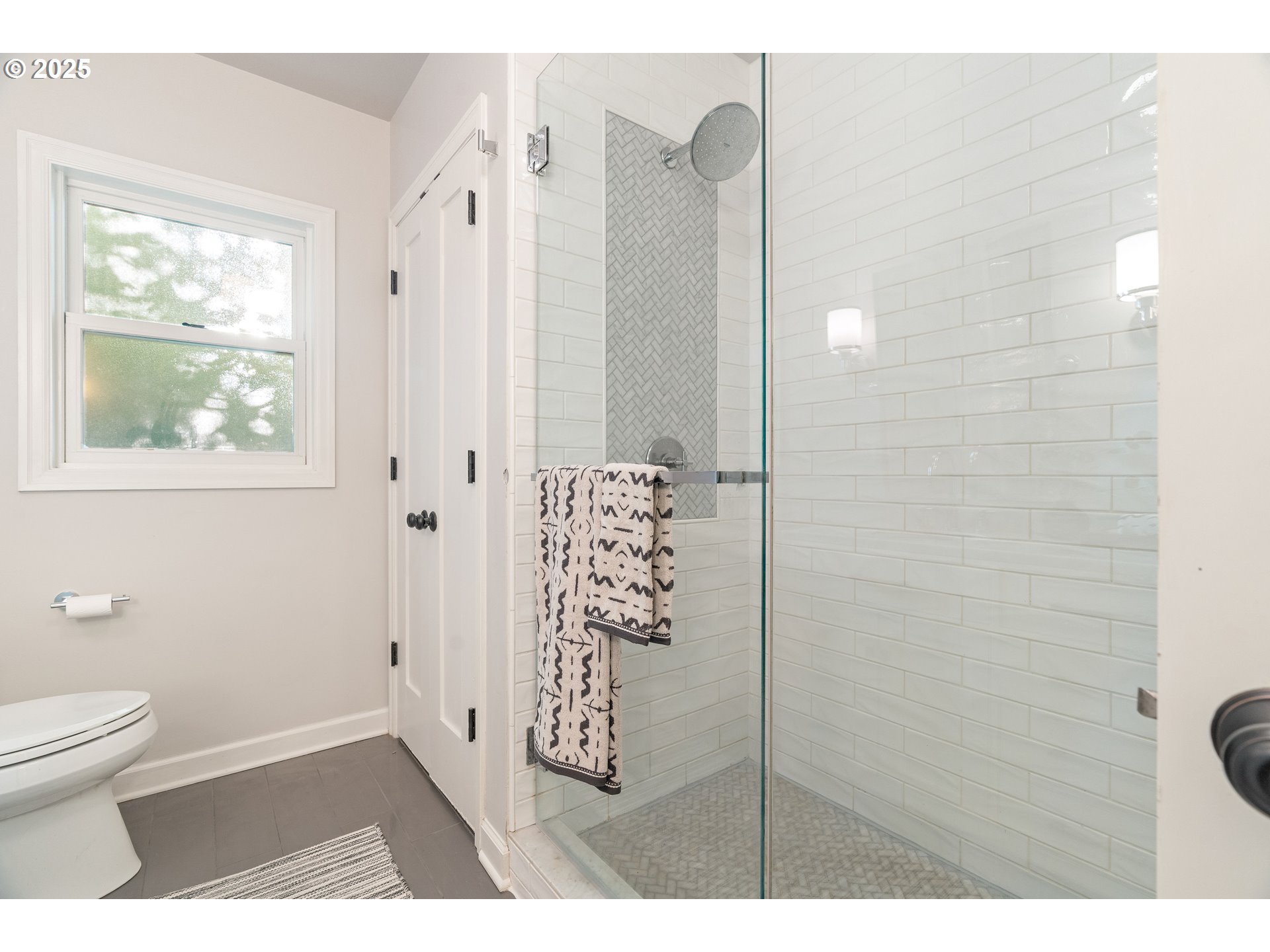 6328 Southwest Brugger Street Portland, OR 97219 - Photo 23 of 48 a bathroom with a shower toilet and a sink