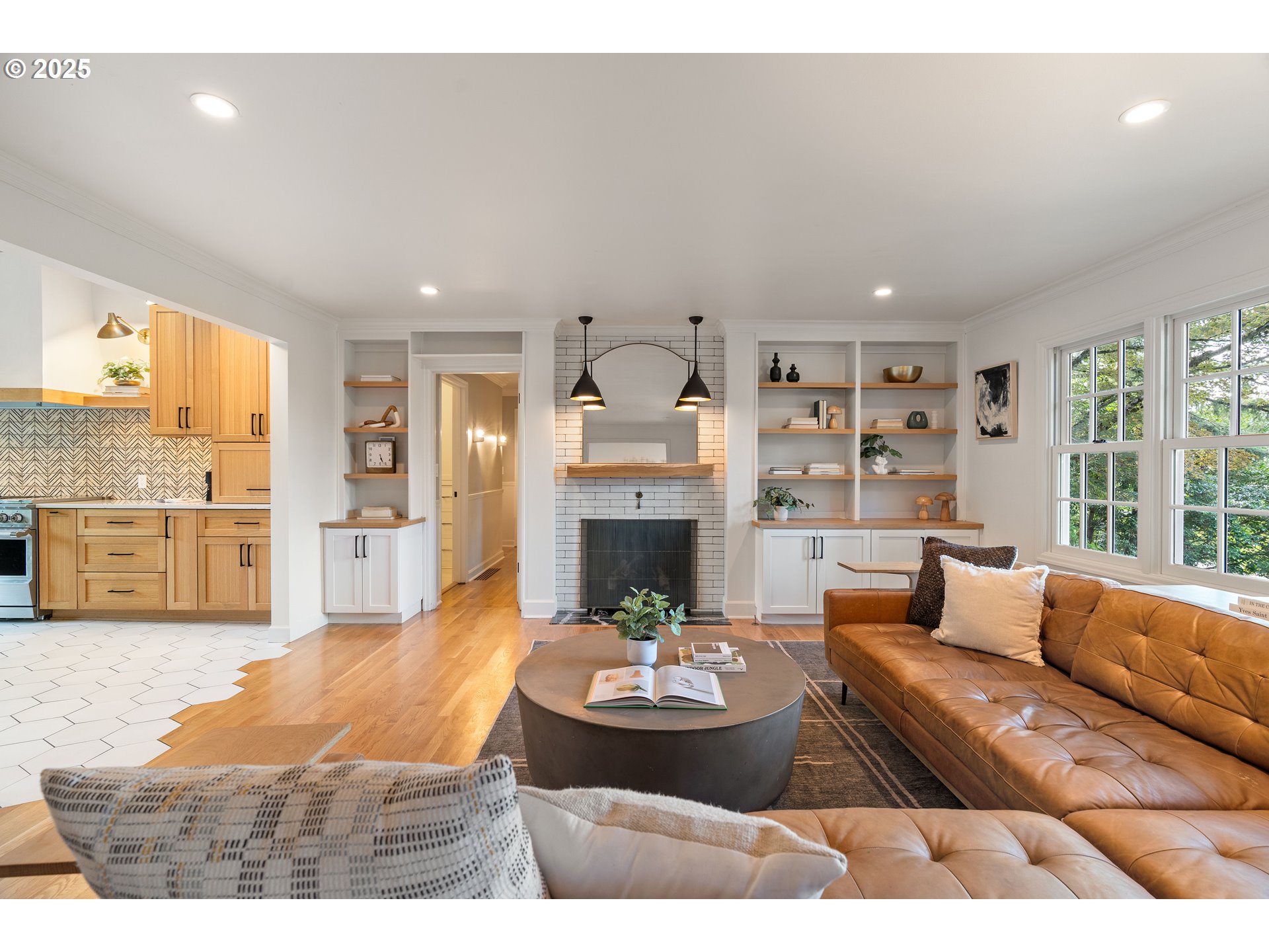 6328 Southwest Brugger Street Portland, OR 97219 - Photo 3 of 48 a living room with furniture and a fireplace