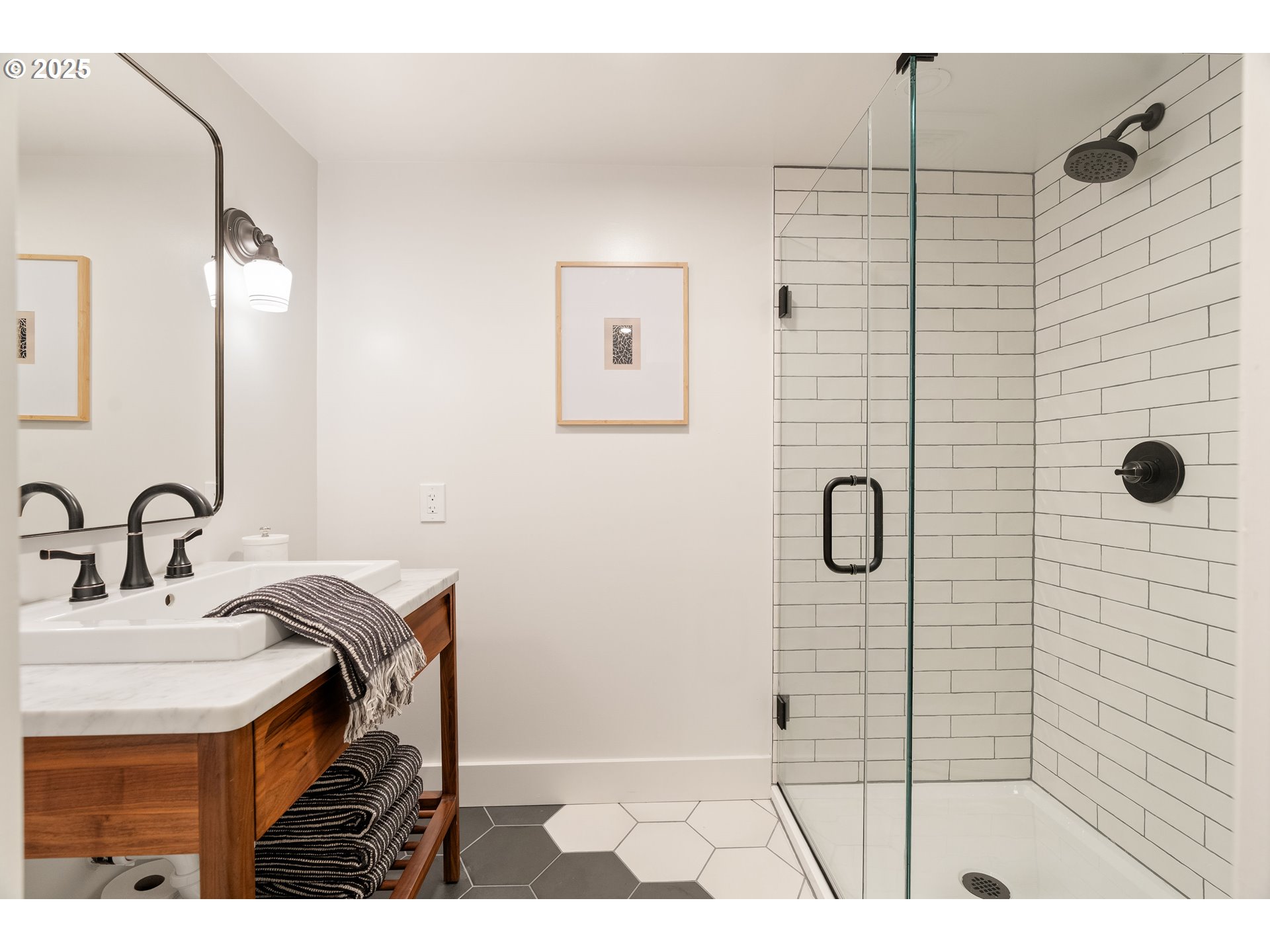 6328 Southwest Brugger Street Portland, OR 97219 - Photo 35 of 48 a bathroom with a sink a mirror and shower