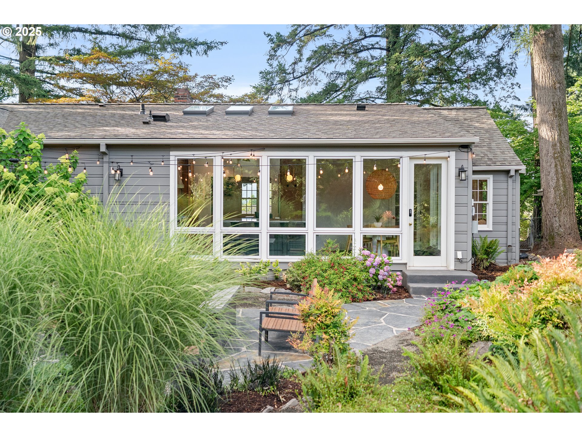 6328 Southwest Brugger Street Portland, OR 97219 - Photo 41 of 48 a view of a house with a garden
