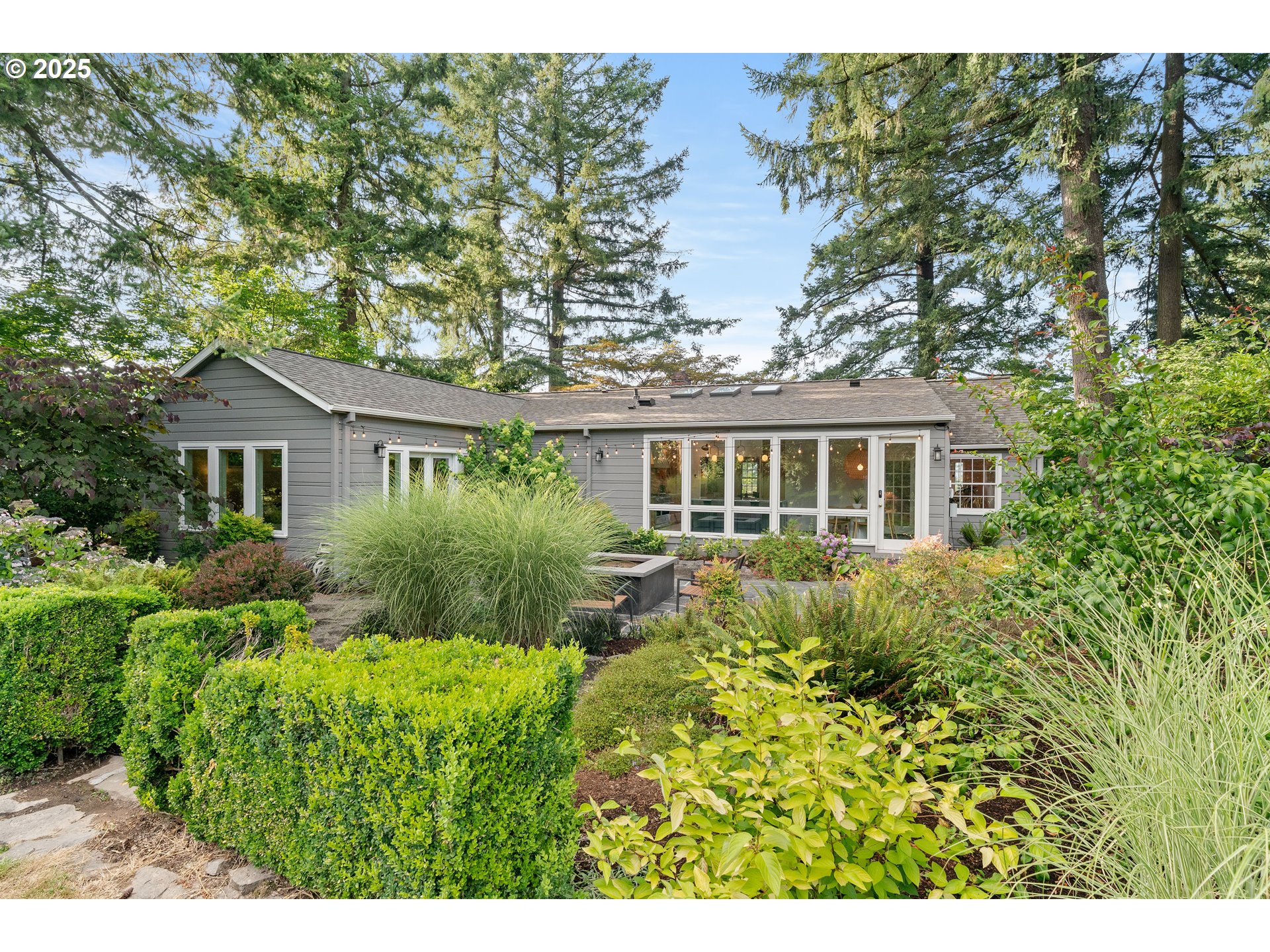 6328 Southwest Brugger Street Portland, OR 97219 - Photo 42 of 48 a aerial view of house with yard and trees in the background