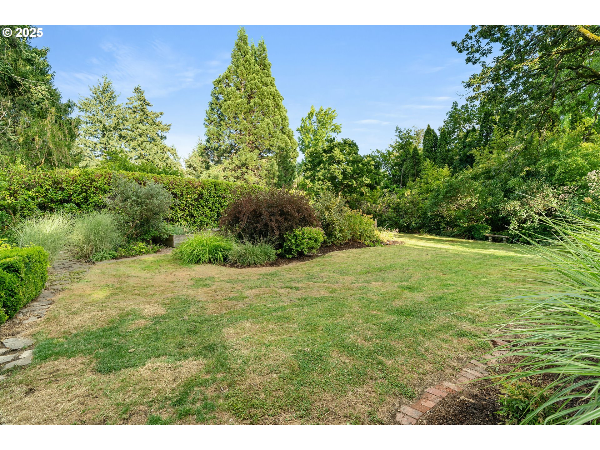 6328 Southwest Brugger Street Portland, OR 97219 - Photo 45 of 48 a view of a yard with an trees