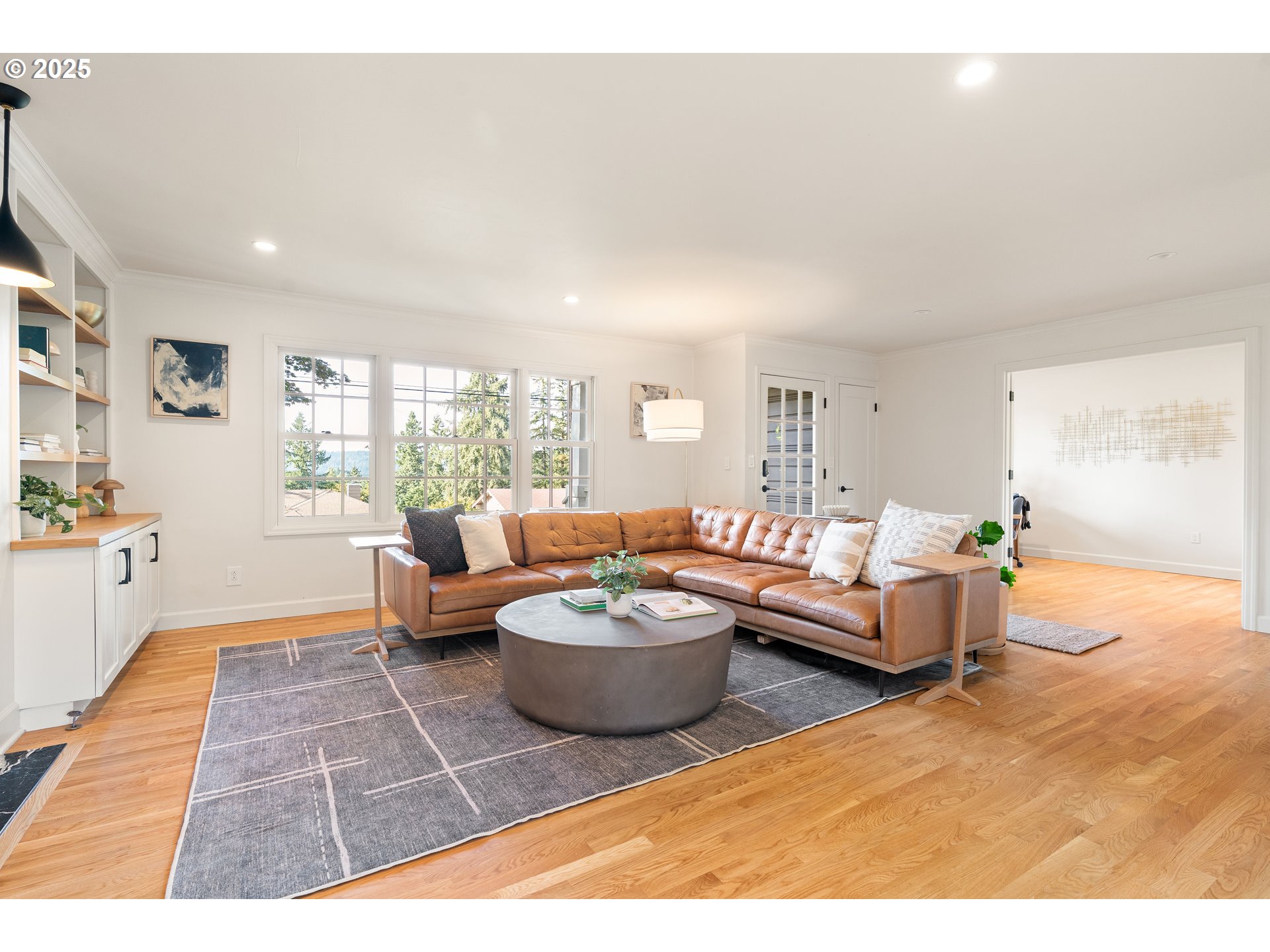 6328 Southwest Brugger Street Portland, OR 97219 - Photo 5 of 48 a living room with furniture and a rug