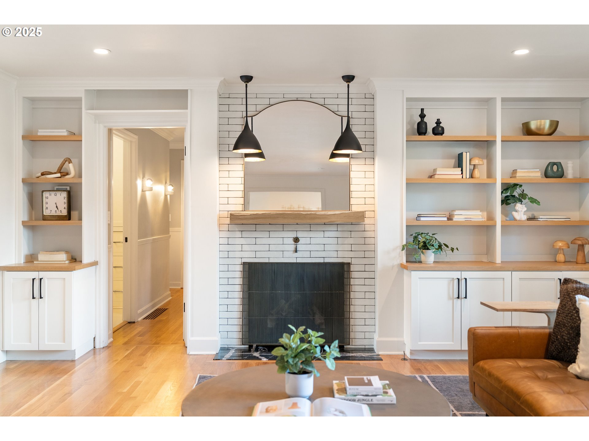 6328 Southwest Brugger Street Portland, OR 97219 - Photo 6 of 48 a view of living room with furniture and a fireplace