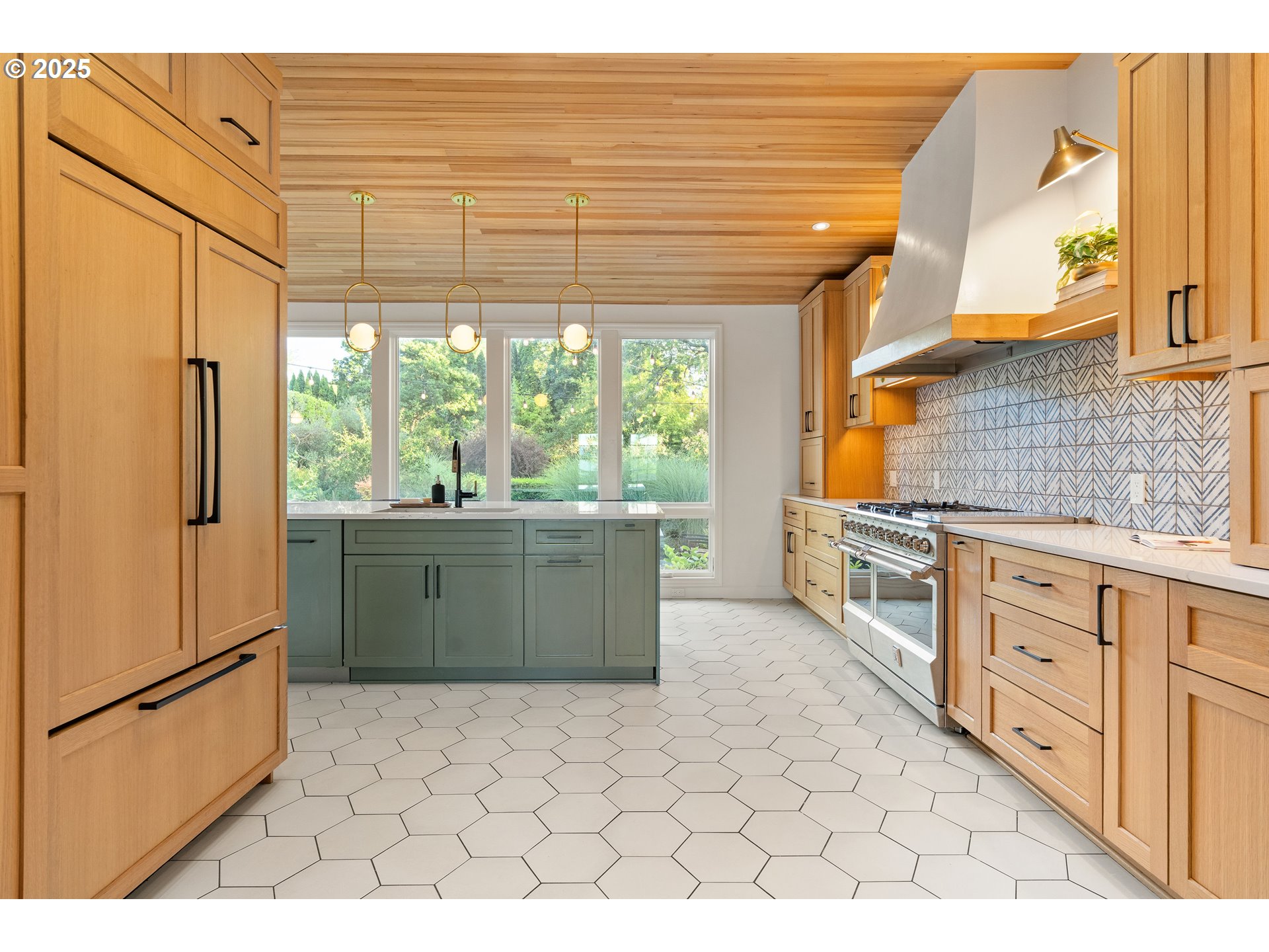 6328 Southwest Brugger Street Portland, OR 97219 - Photo 7 of 48 a kitchen with stainless steel appliances a refrigerator sink and cabinets