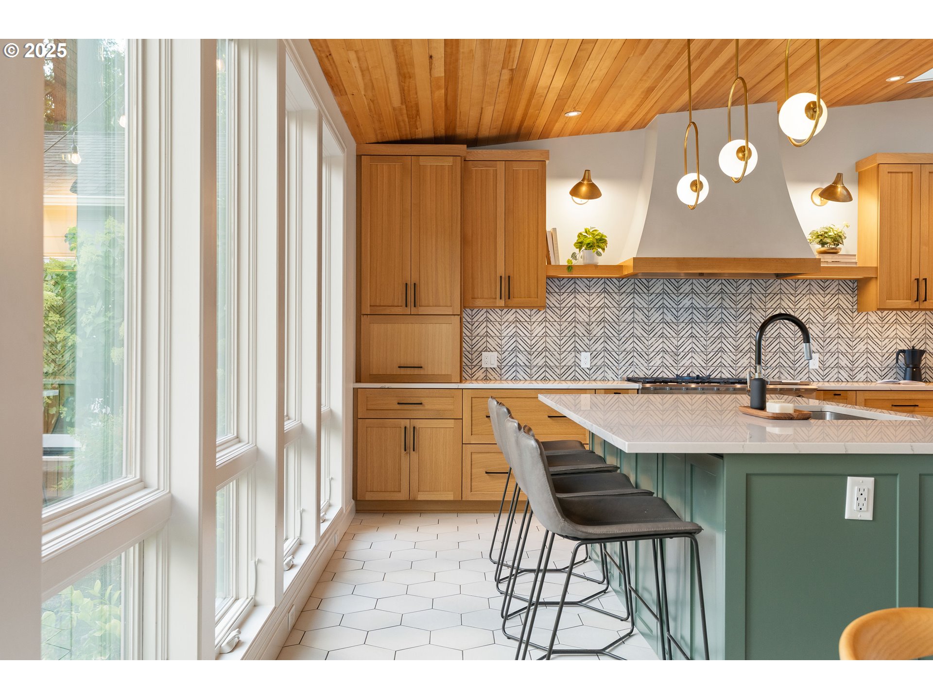6328 Southwest Brugger Street Portland, OR 97219 - Photo 9 of 48 a kitchen with a sink and a refrigerator