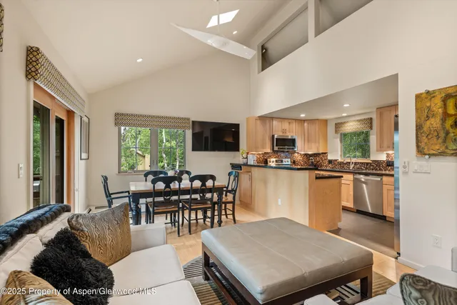 a living room with fireplace furniture and a flat screen tv