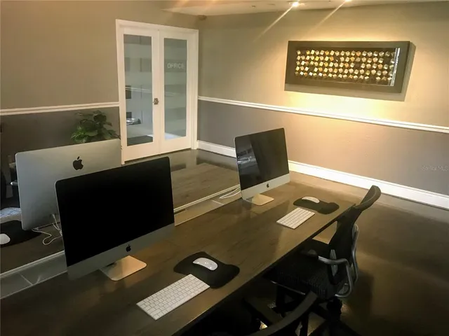 a view of a workspace with furniture