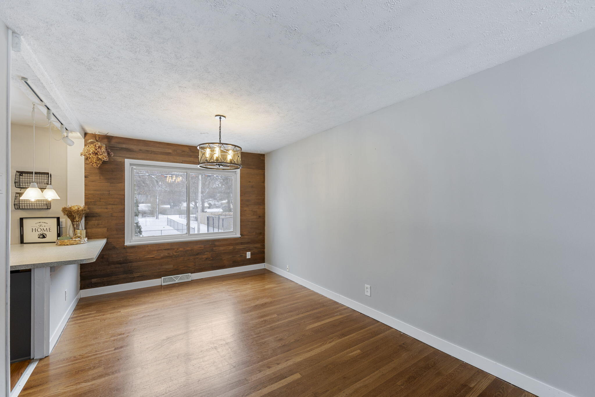 1807 West Porter Avenue Chesterton, IN 46304 - Photo 6 of 23 an empty room with wooden floor and windows