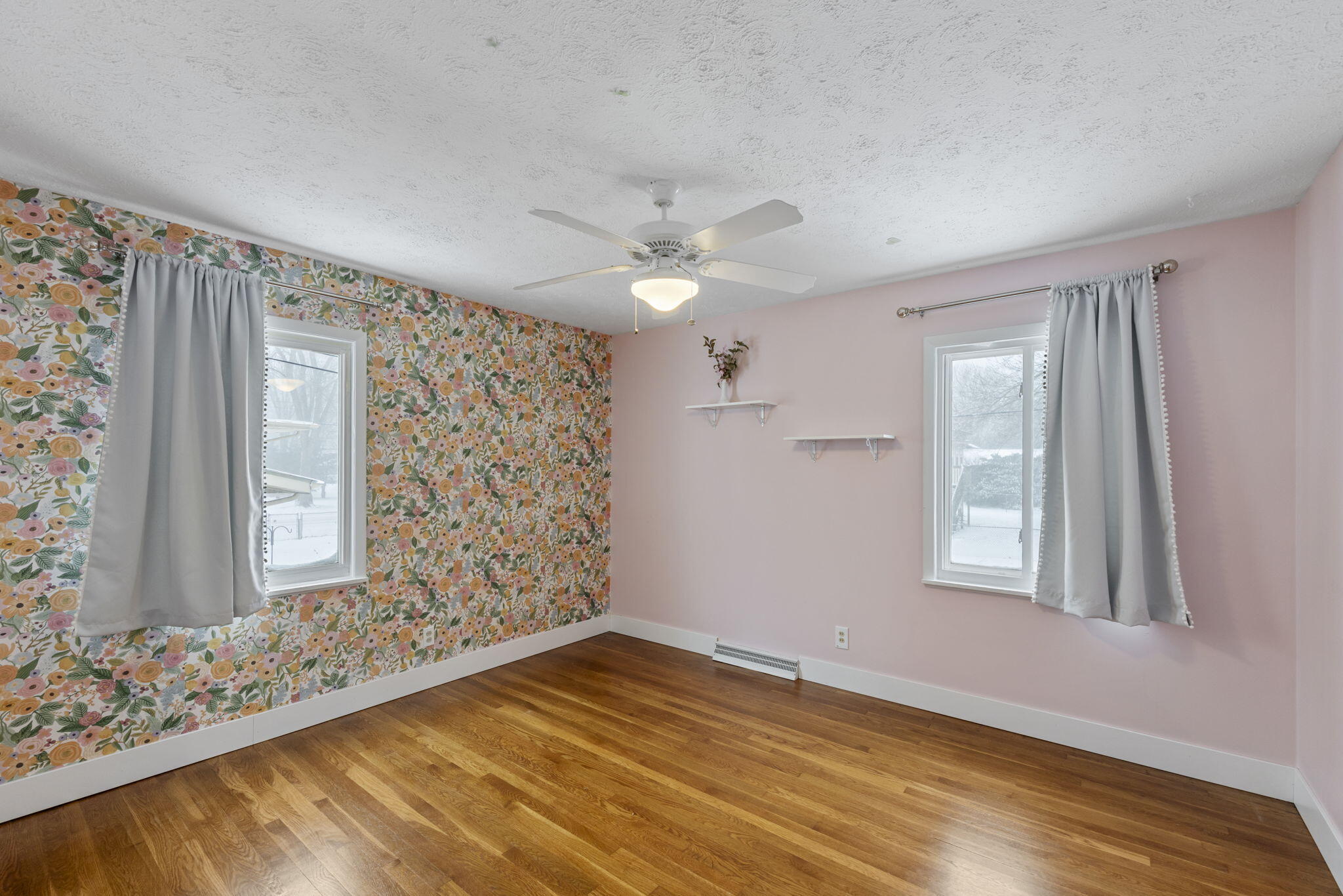 1807 West Porter Avenue Chesterton, IN 46304 - Photo 10 of 23 a view of an empty room with a window and wooden floor