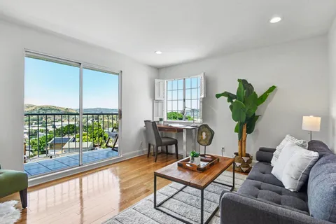 a view of a balcony with chairs