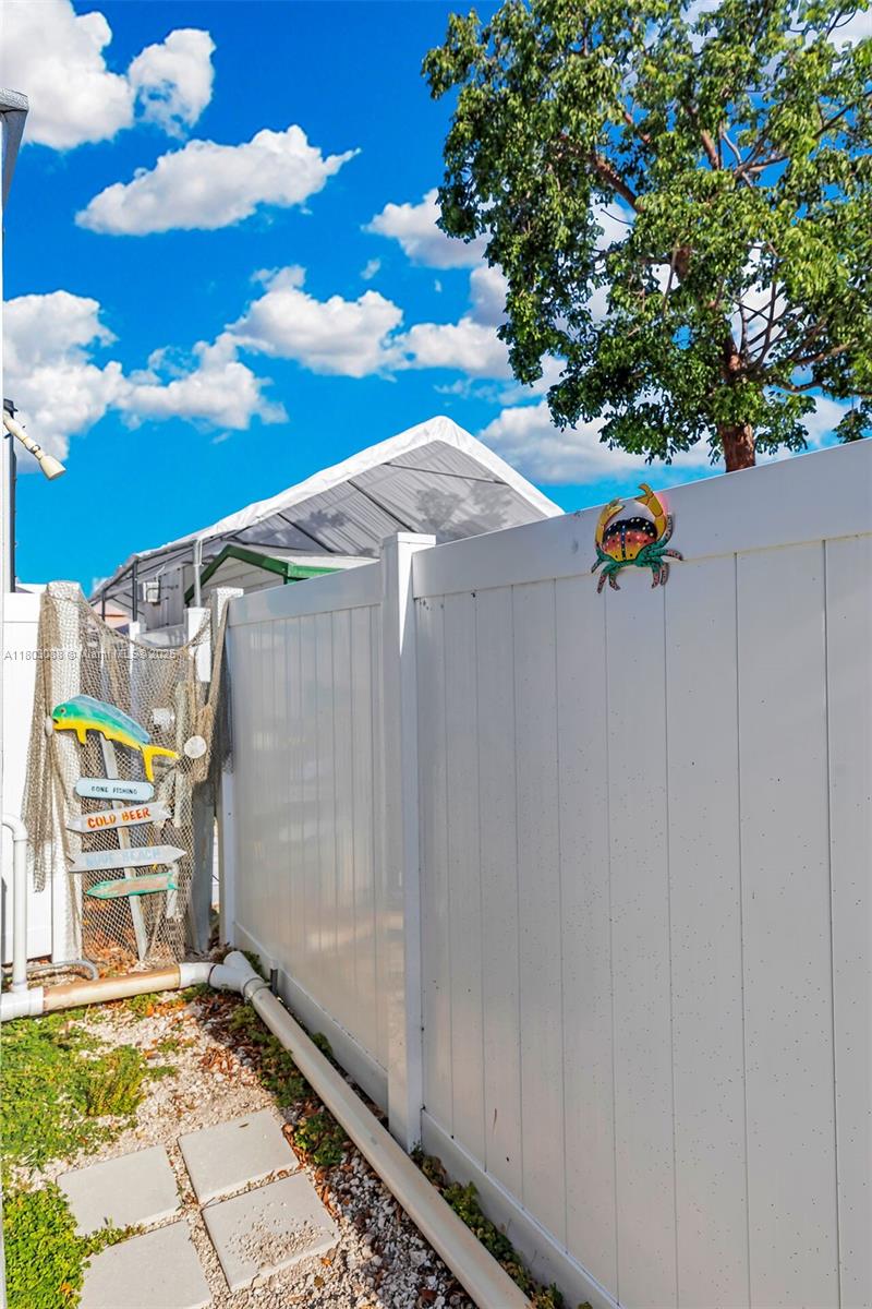 325 Calusa Street Key Largo, FL 33037 - Photo 25 of 34 a view of an entryway with a tree