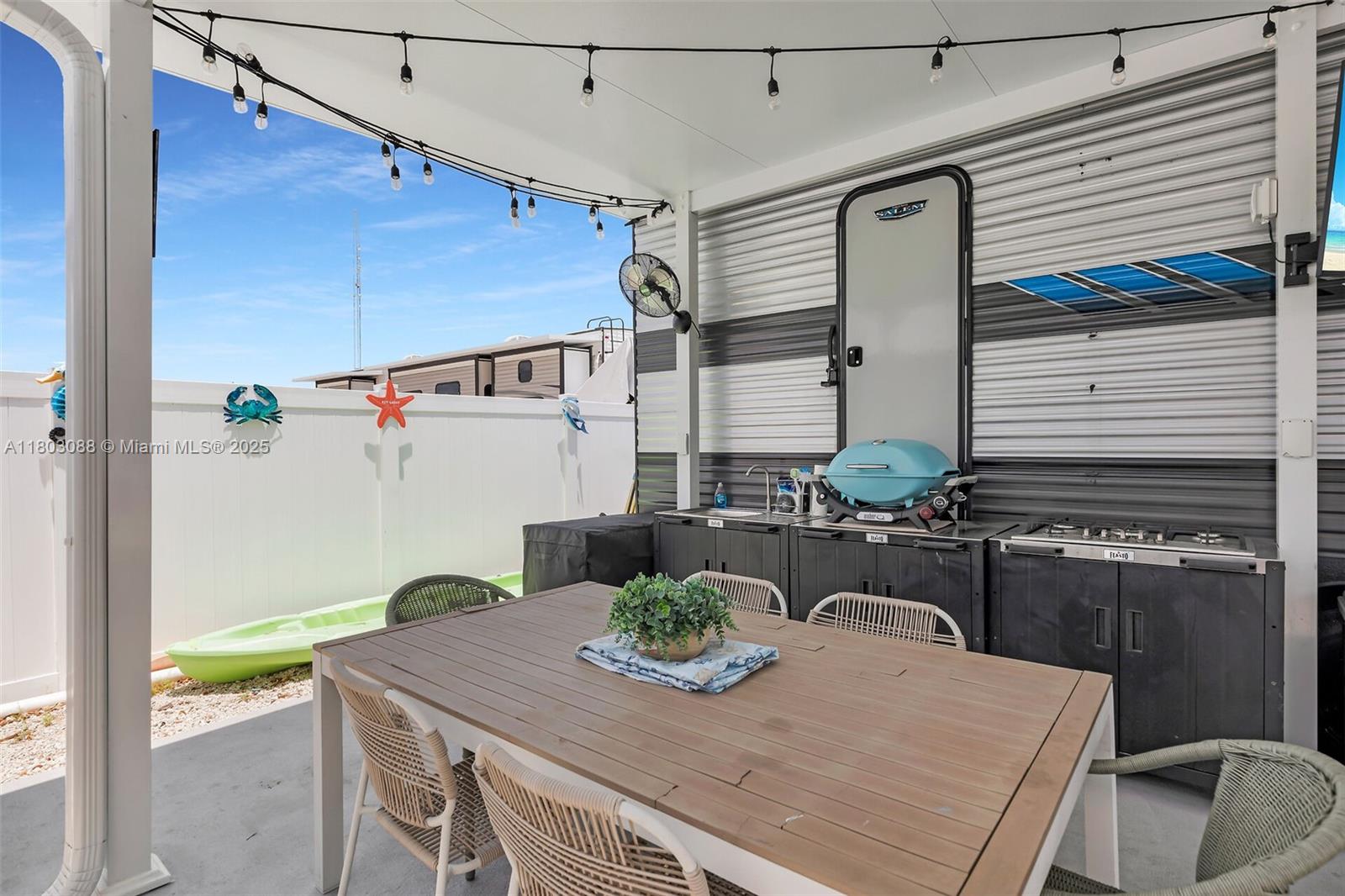 325 Calusa Street Key Largo, FL 33037 - Photo 7 of 34 a view of a dining room with furniture