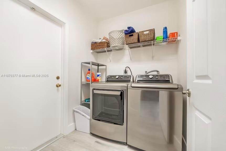 16013 Southwest 148th Terrace Miami, FL 33196 - Photo 15 of 20 a kitchen with white cabinets and white appliances