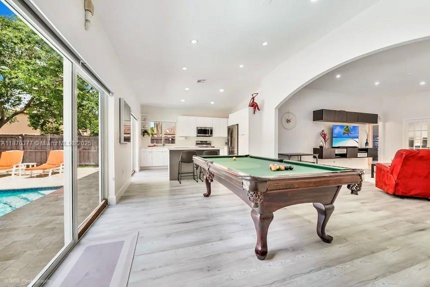 16013 Southwest 148th Terrace Miami, FL 33196 - Photo 6 of 20 a room with pool table and windows