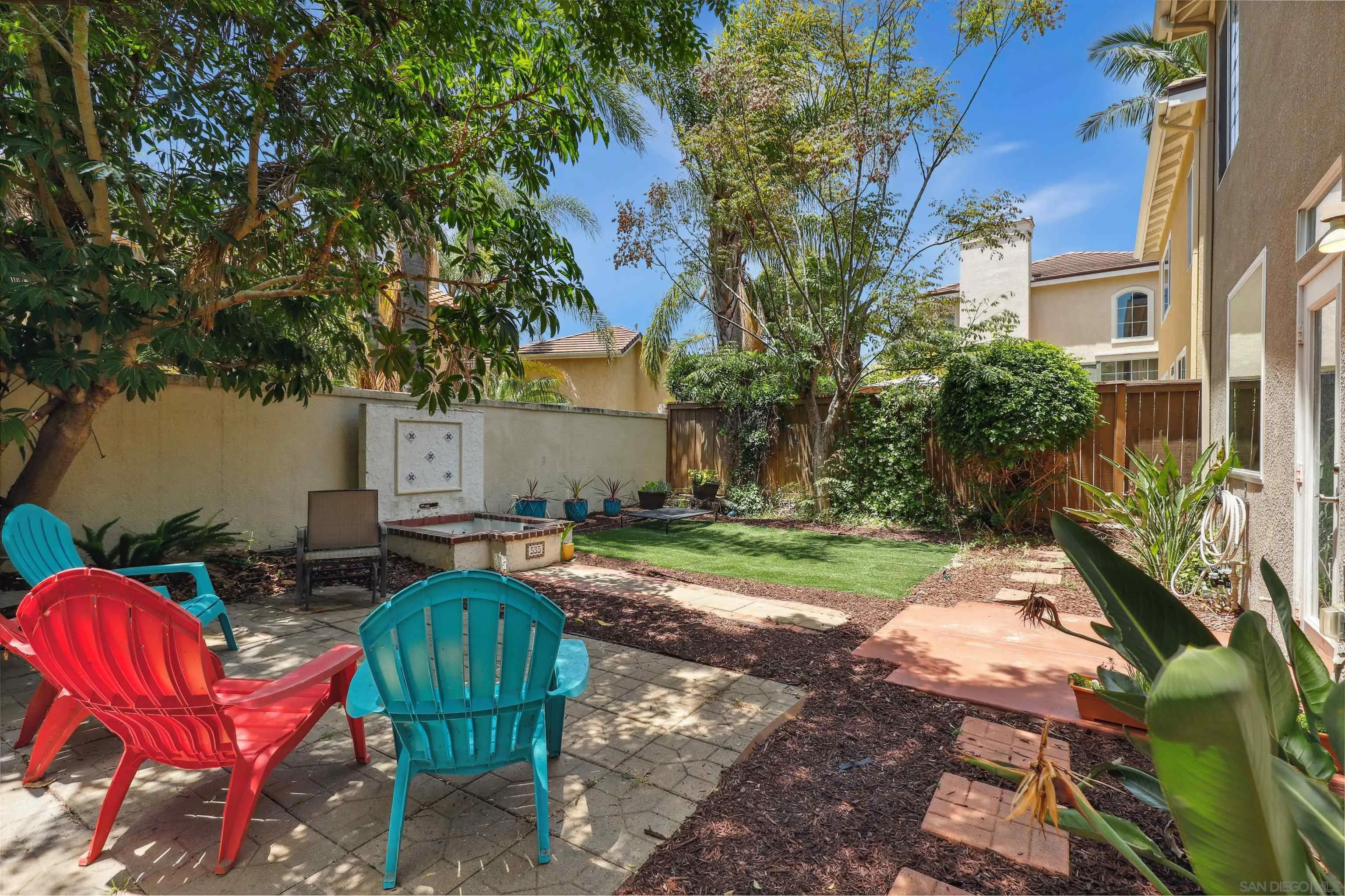 535 Venetia Way Oceanside, CA 92057 - Photo 19 of 27 a backyard of a house with barbeque oven table and chairs
