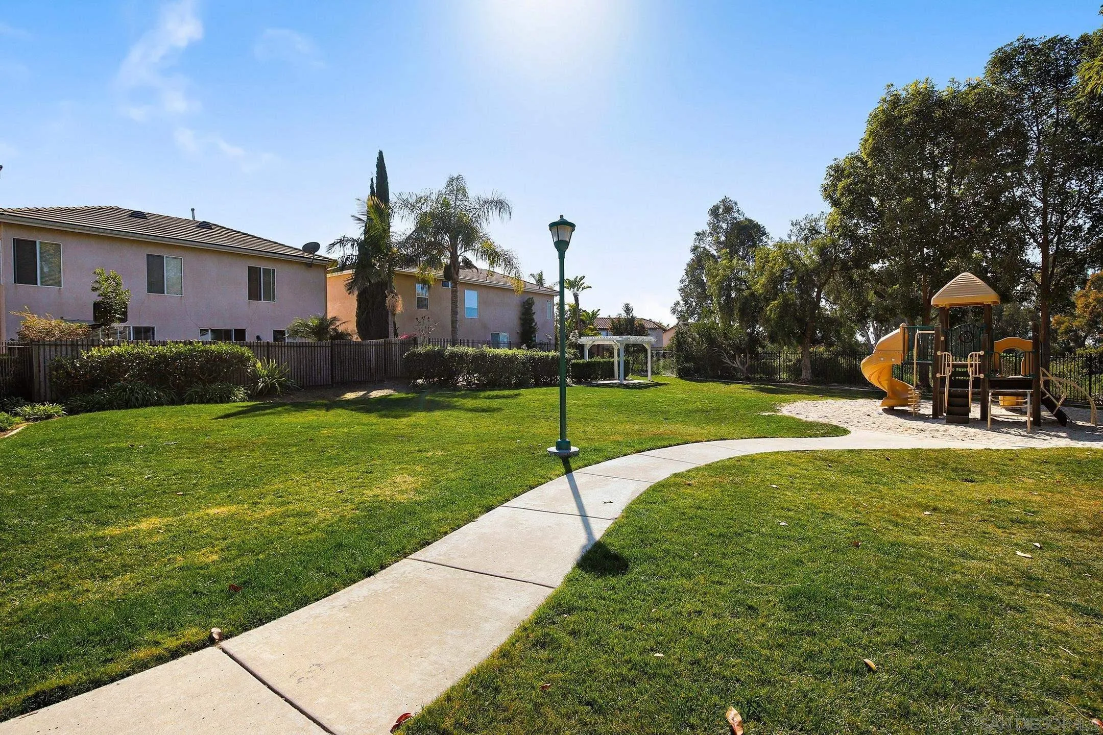 535 Venetia Way Oceanside, CA 92057 - Photo 27 of 27 a view of a house with a backyard