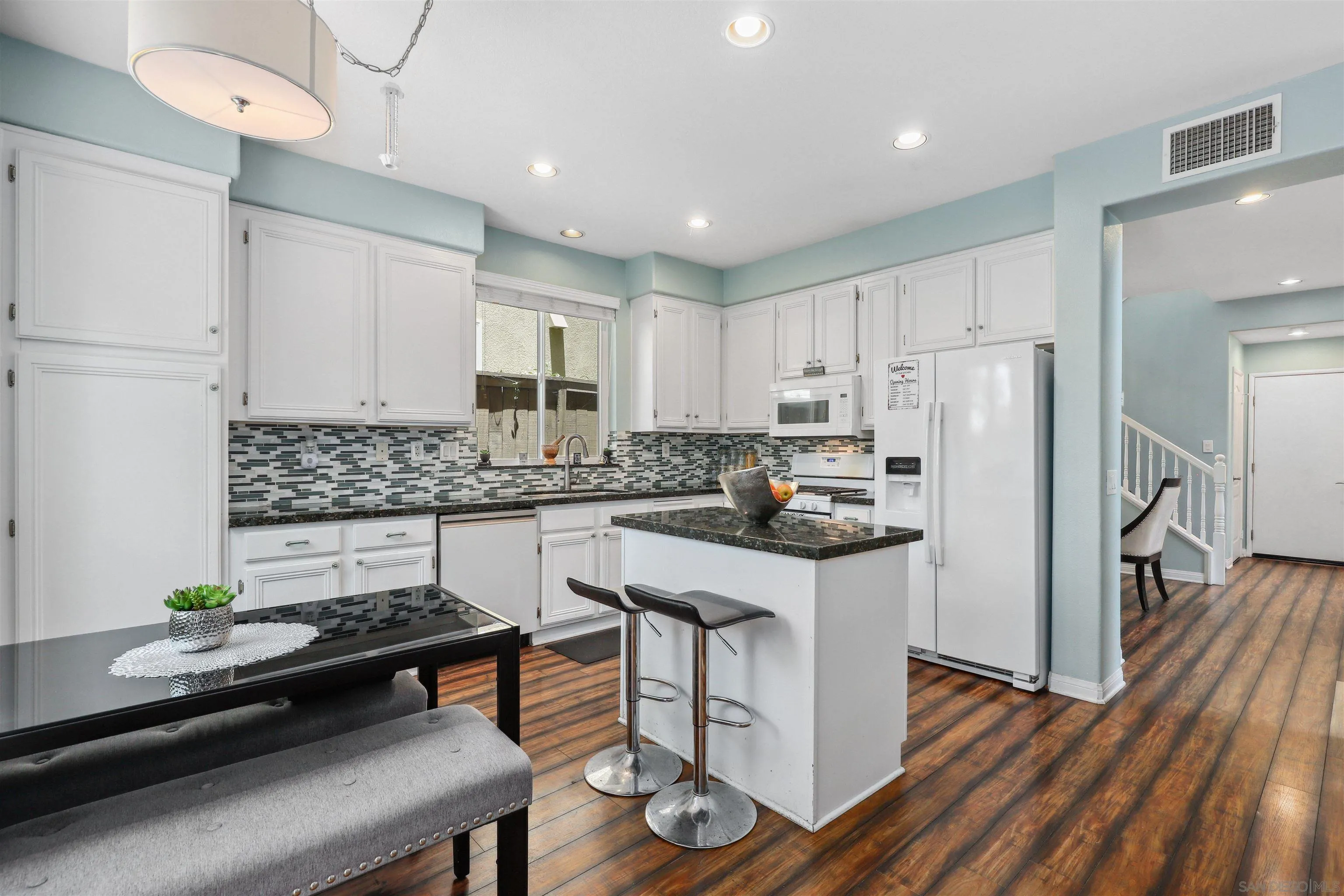 535 Venetia Way Oceanside, CA 92057 - Photo 6 of 27 a kitchen with stainless steel appliances a stove a sink a refrigerator and cabinets
