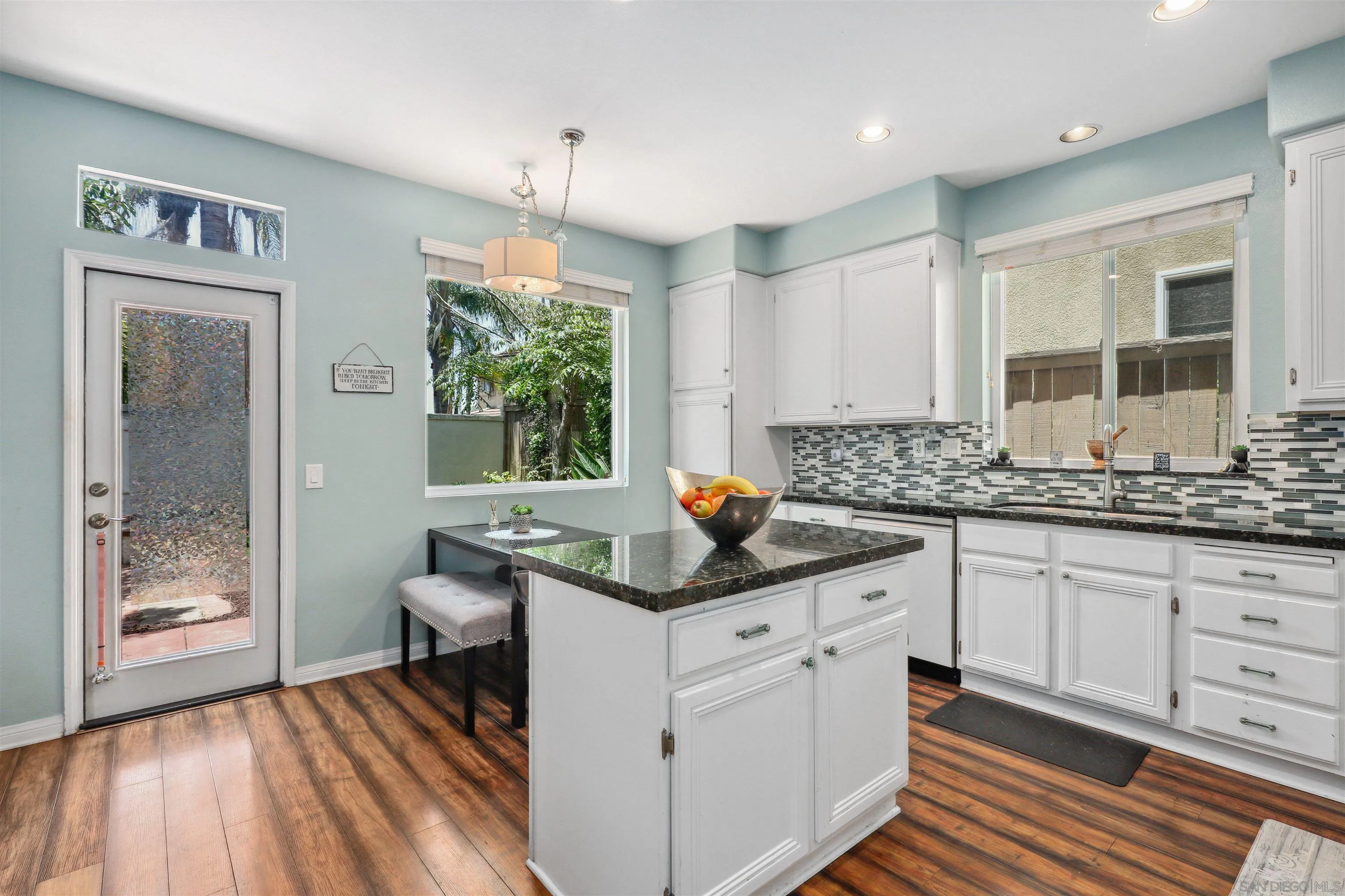 535 Venetia Way Oceanside, CA 92057 - Photo 7 of 27 a kitchen with stainless steel appliances granite countertop a sink stove and cabinets