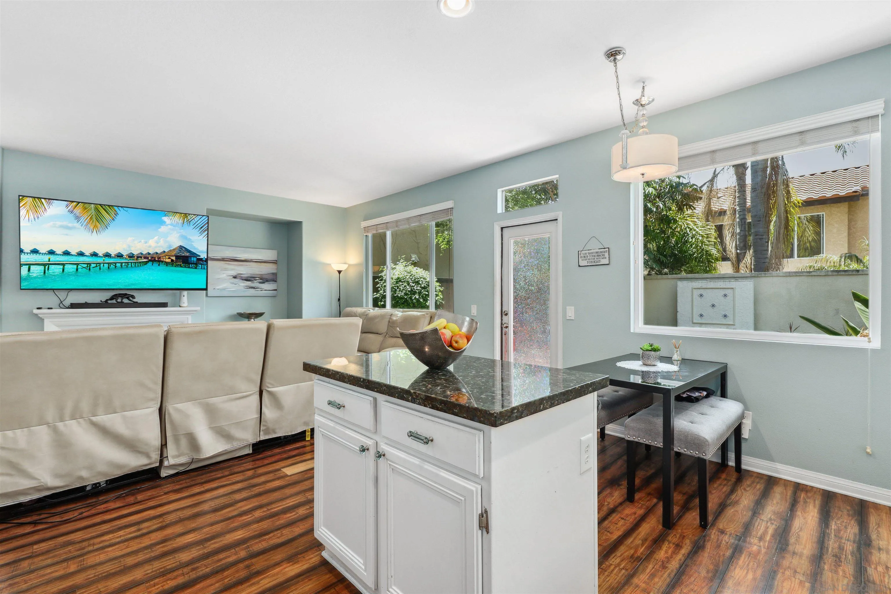 535 Venetia Way Oceanside, CA 92057 - Photo 8 of 27 a kitchen with white cabinets and window