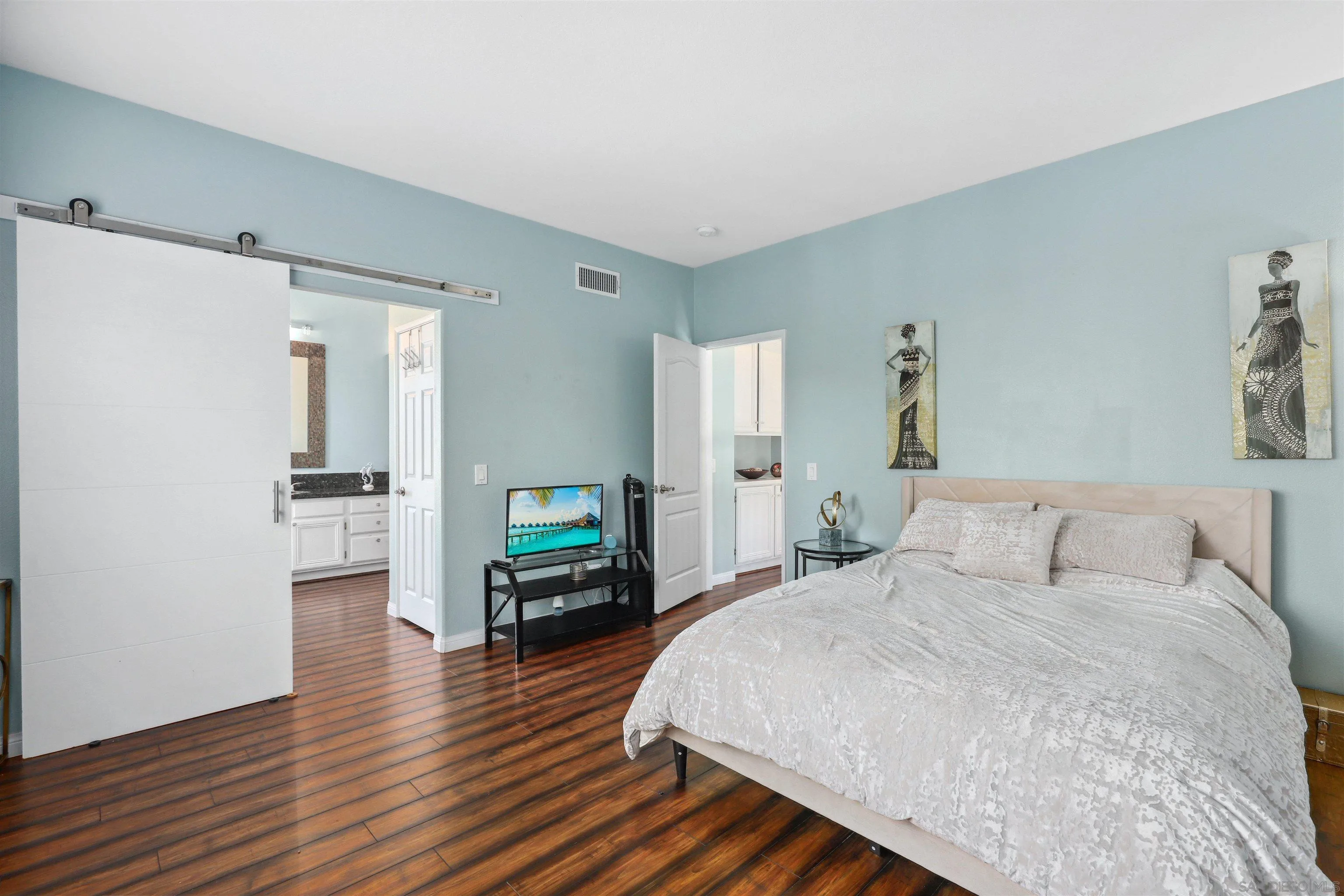 535 Venetia Way Oceanside, CA 92057 - Photo 10 of 27 a bedroom with a bed and a television in it