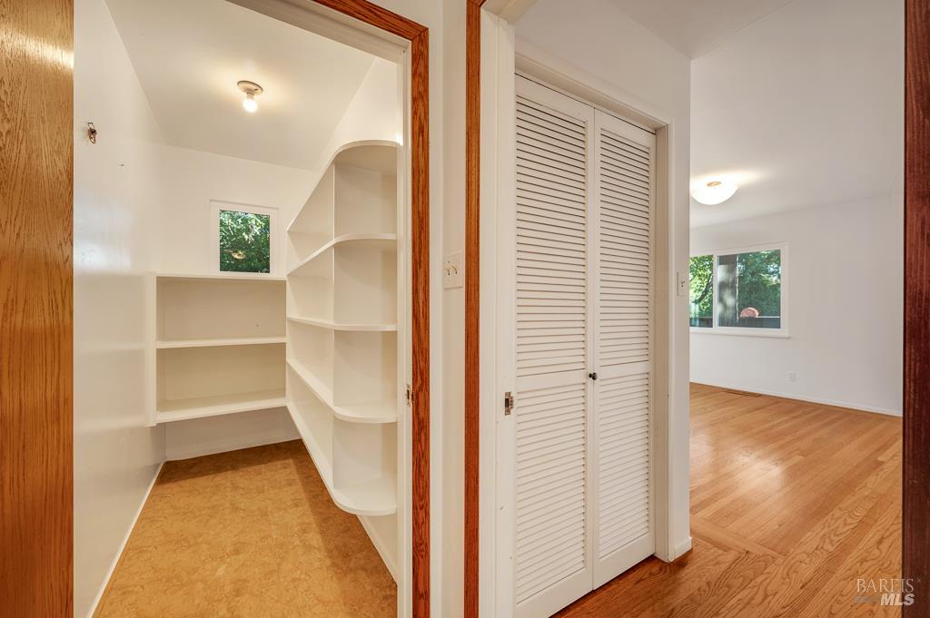 815 Dry Creek Road Healdsburg, CA 95448 - Photo 21 of 37 a view of a hallway to rooms and wooden floor