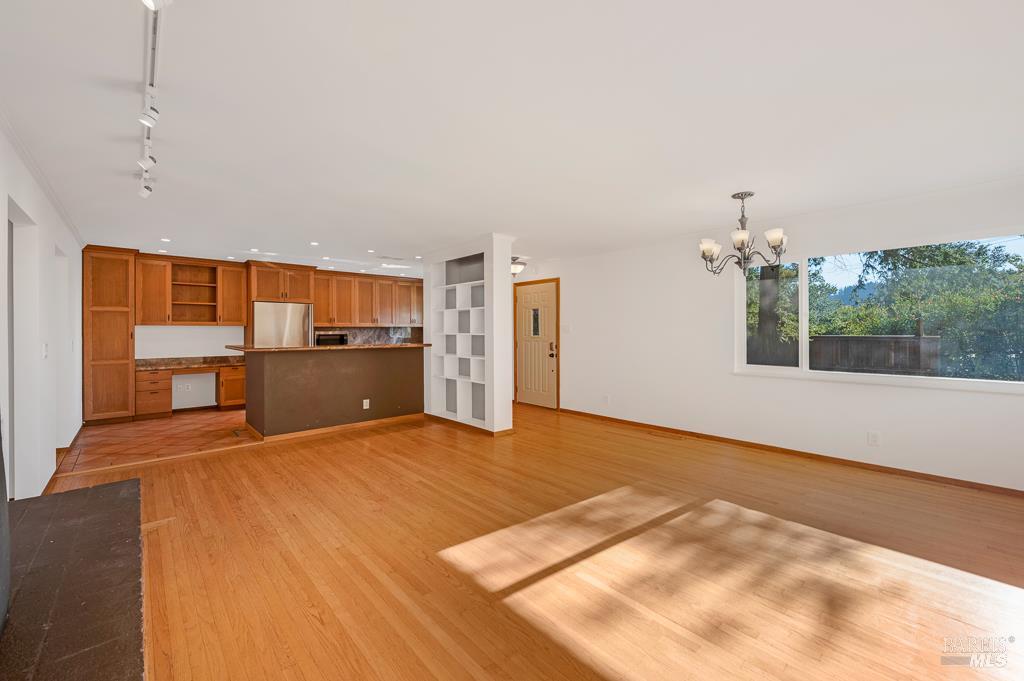 815 Dry Creek Road Healdsburg, CA 95448 - Photo 4 of 37 a view of a kitchen with a sink and a kitchen counter top