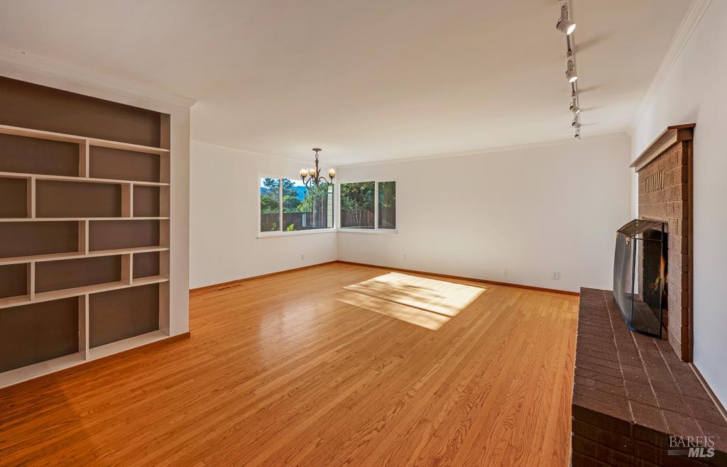 815 Dry Creek Road Healdsburg, CA 95448 - Photo 8 of 37 a view of empty room with wooden floor and fan