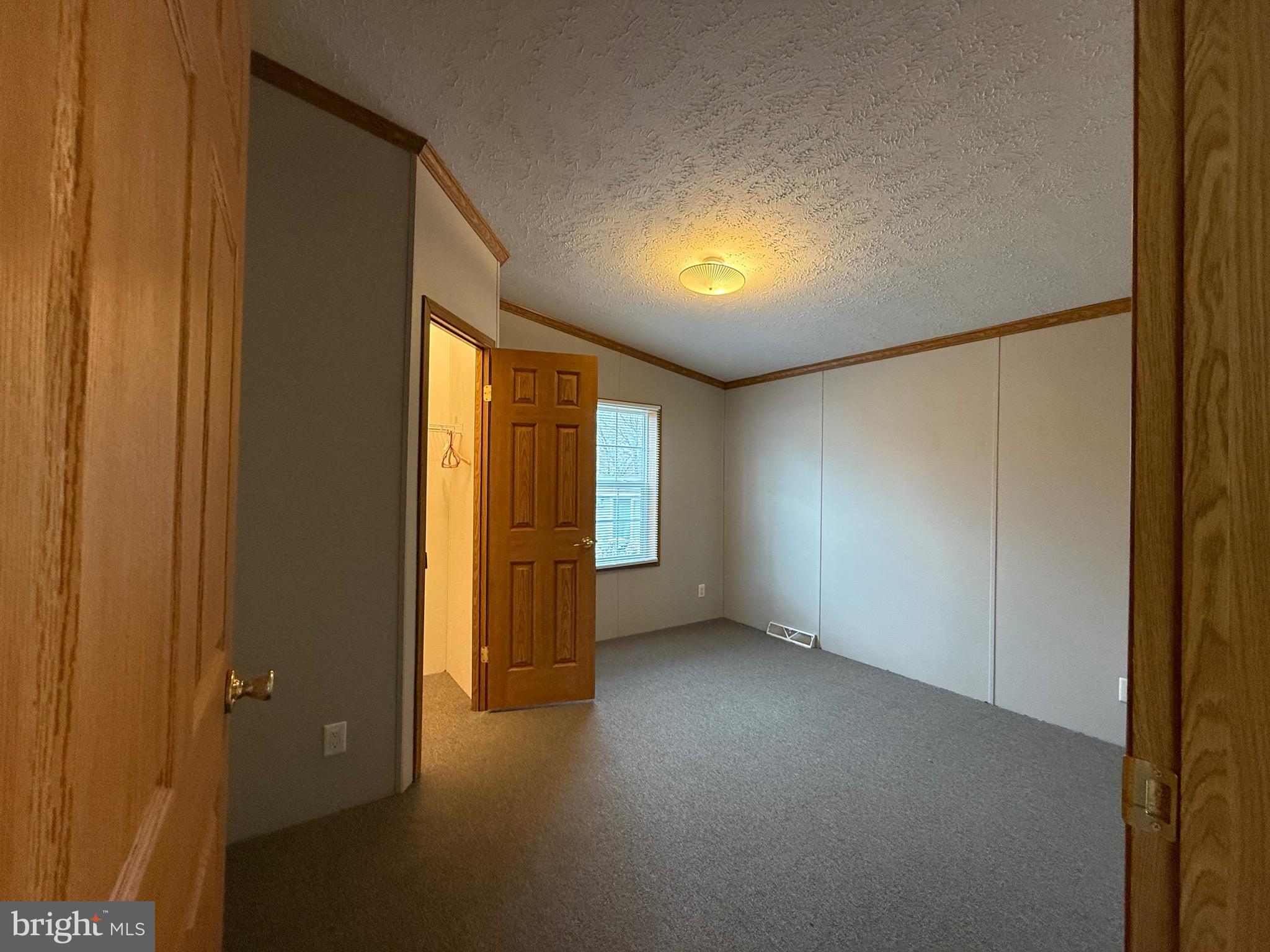 8731 Turkey Ridge Road Breinigsville, PA 18031 - Photo 19 of 68 a view of an empty room with a window