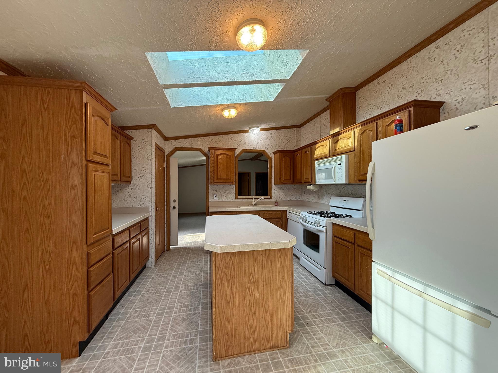 8731 Turkey Ridge Road Breinigsville, PA 18031 - Photo 44 of 68 a kitchen with stainless steel appliances granite countertop a stove and a refrigerator