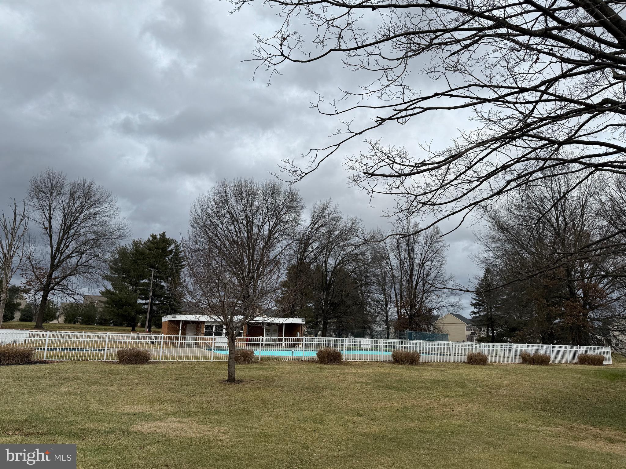 8731 Turkey Ridge Road Breinigsville, PA 18031 - Photo 61 of 68 a view of a swimming pool with an outdoor space and seating area