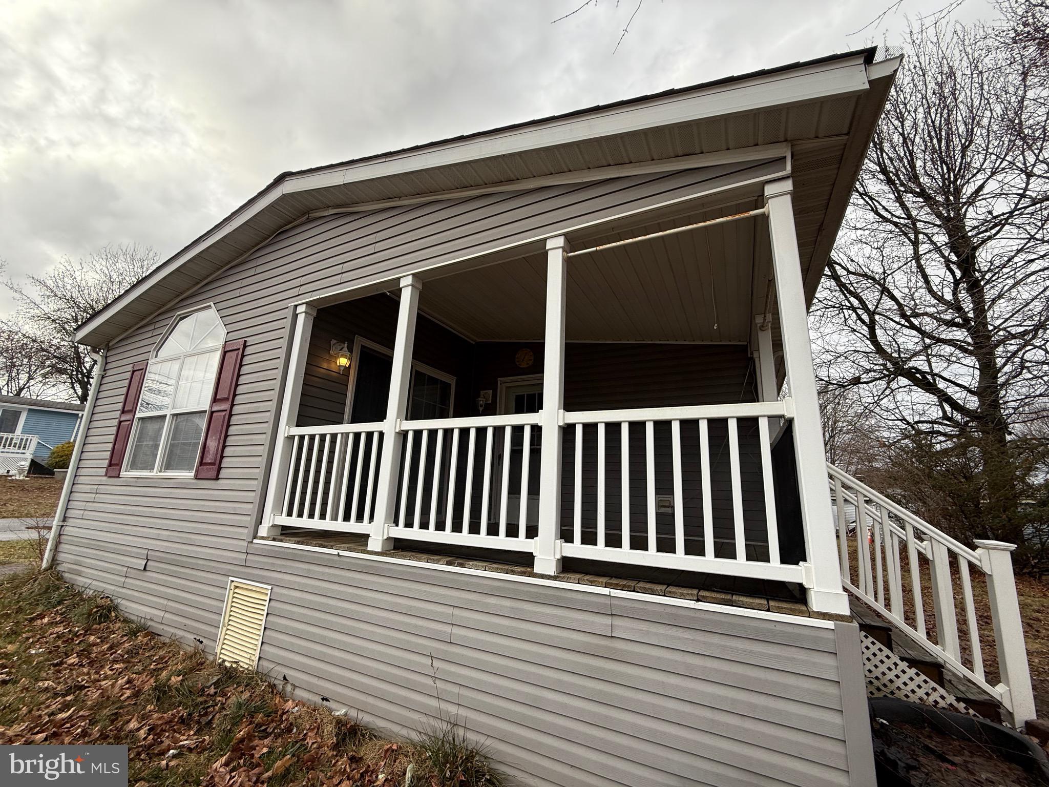 8731 Turkey Ridge Road Breinigsville, PA 18031 - Photo 9 of 68 a view of deck with a chair and floor to ceiling window